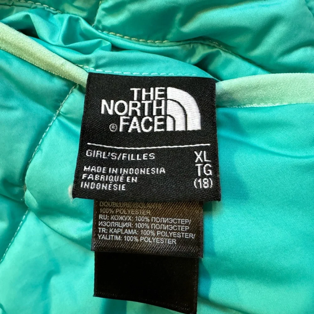 The North Face reversible puffers jacket.  Green, yellow, white swirl. Girls XL